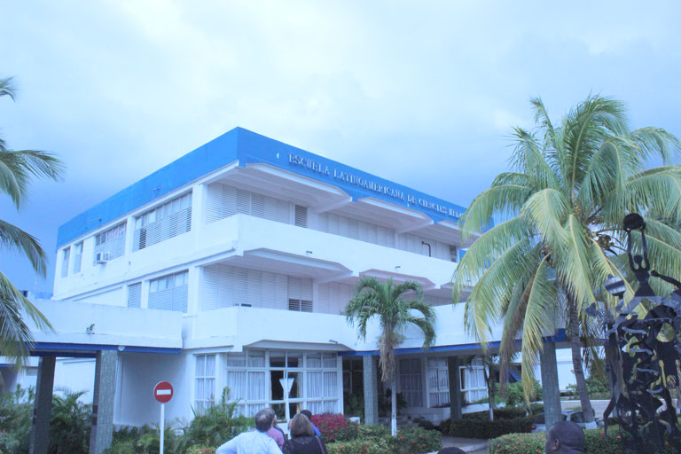 Blue and white building of the Latin American School of Medicine in Cuba.